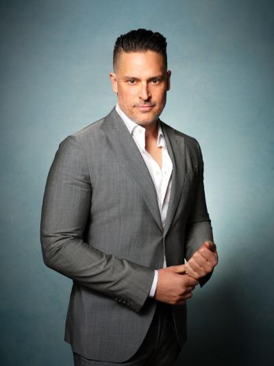 A professional photo of Joe Manganiello in a gray suit